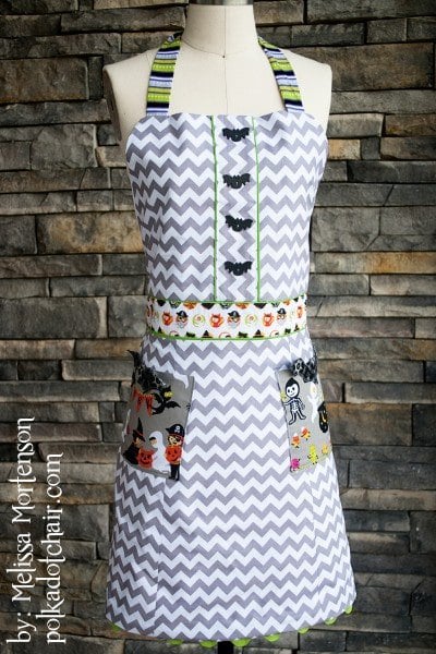 Halloween Apron Sewing Pattern on dress form in front of stone wall