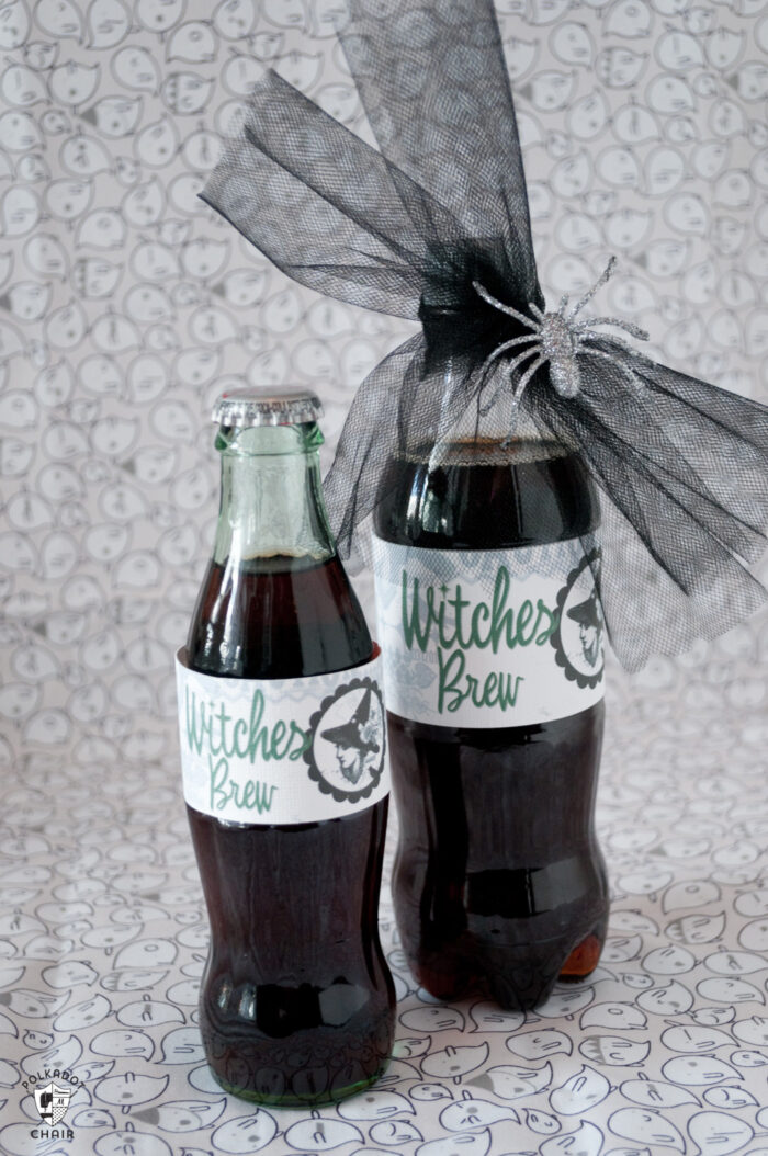 two bottles of diet coke with witches brew labels on white background