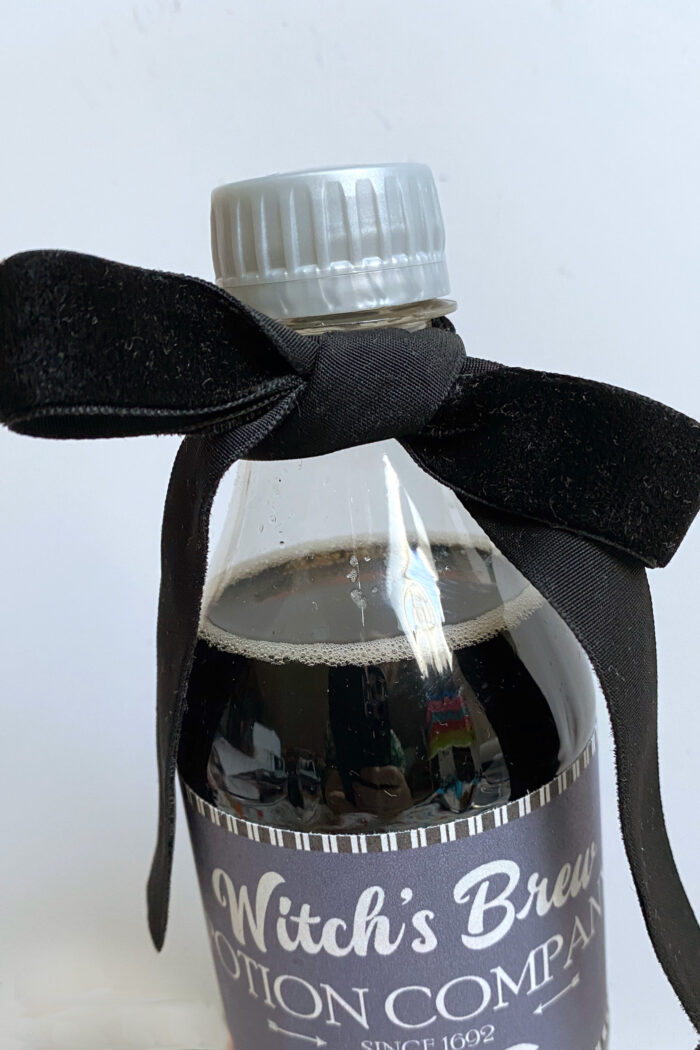 black velvet ribbon on soda bottle