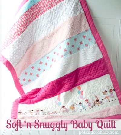 striped textured baby quilt in pinks and blues