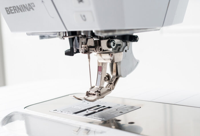 Bernina sewing machine on white background - close up of presser foot
