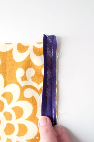 purple bias tape on yellow fabric