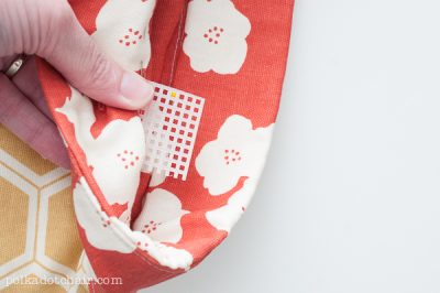 adding leather handles to a handbag