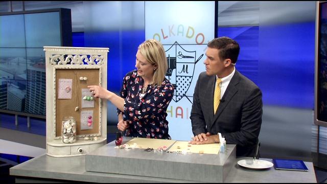 image of woman on tv demonstrating seashell crafts