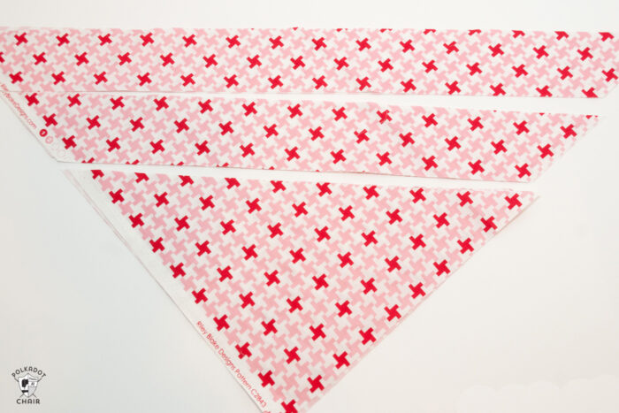 red and white fabric on white cutting mat