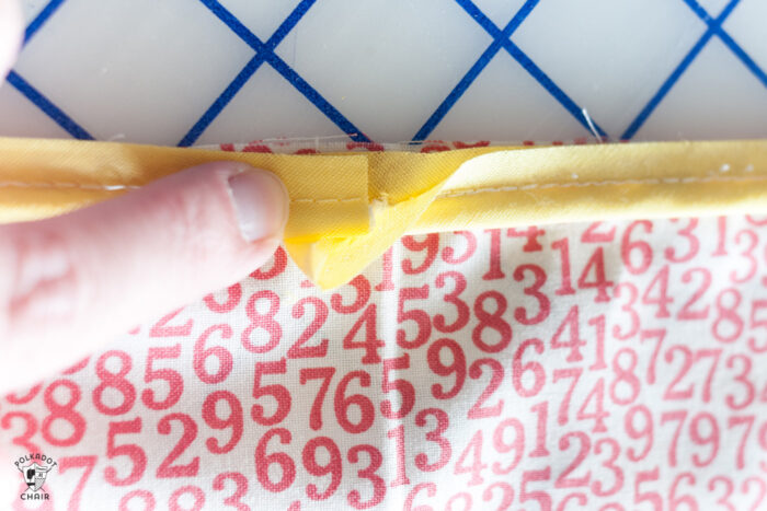 red and white fabric on white cutting mat