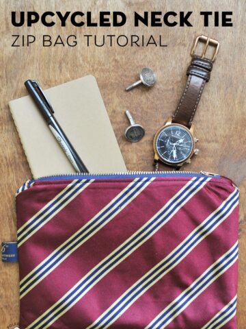 Upcycled neck tie zip pouch on brown table