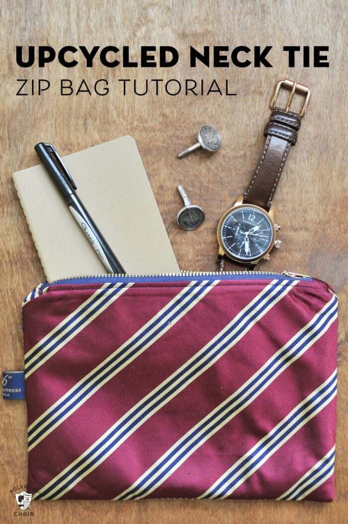 Upcycled neck tie zip pouch on brown table
