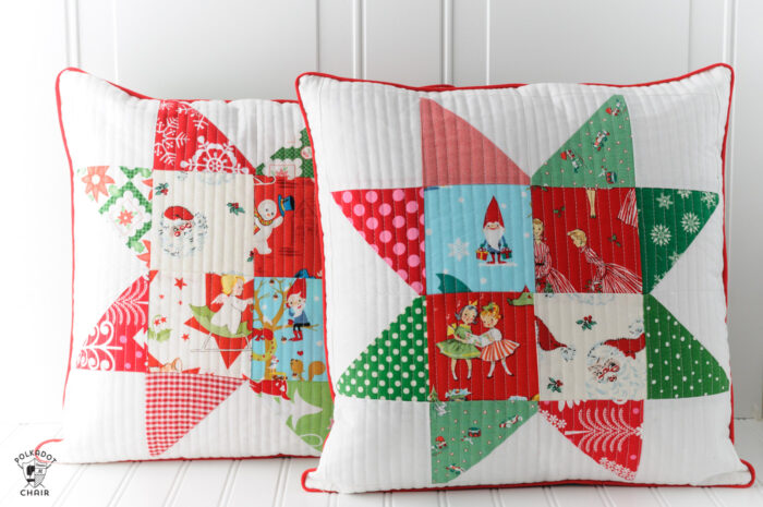 Patchwork Christmas pillows on white table