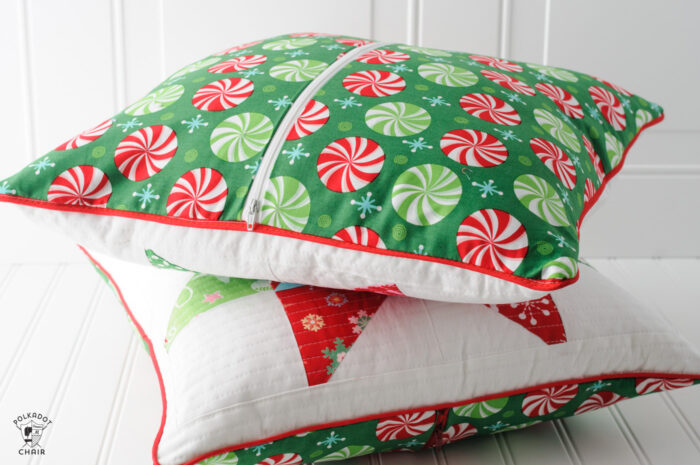 Patchwork Christmas pillows on white table