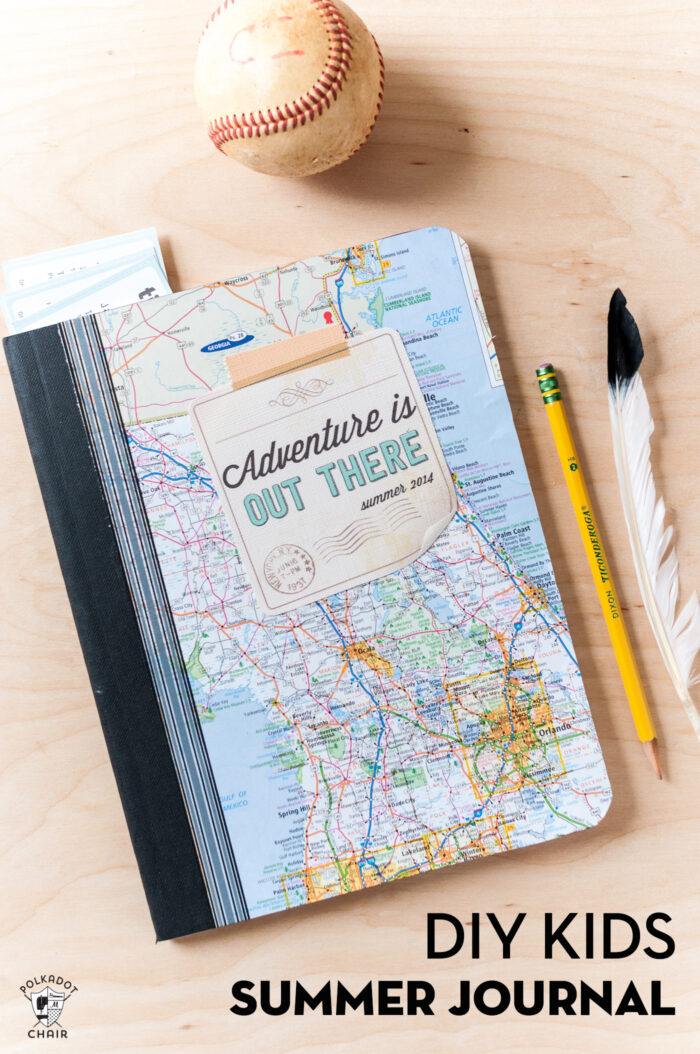 kids composition notebook with map cover on wood table