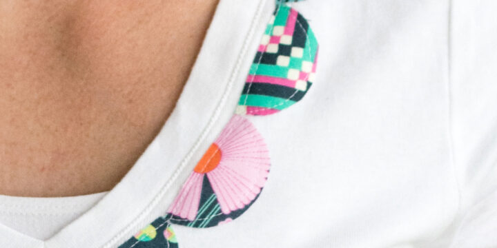 white t shirt with blue scallops on model