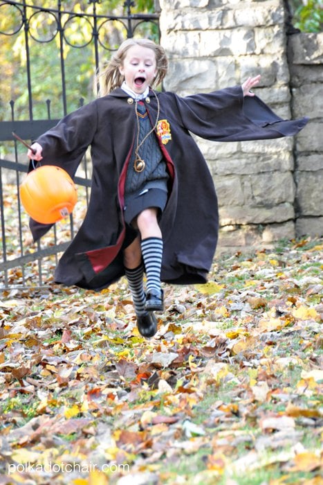 Child in Harry Potter robe outdoors