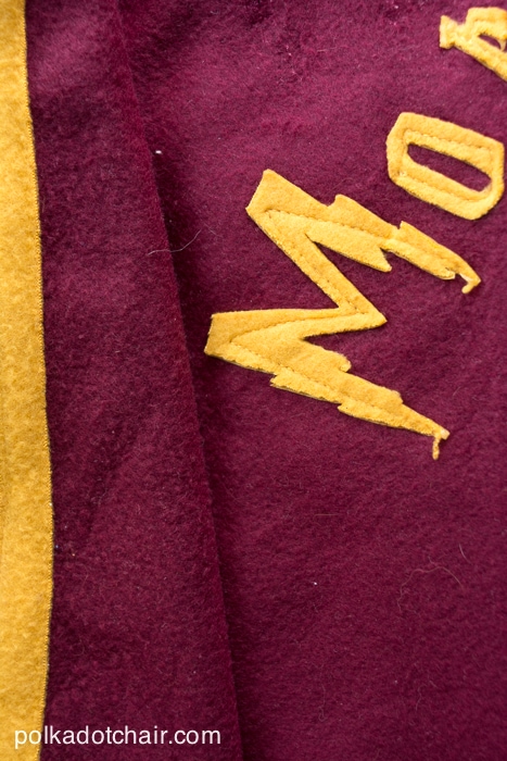 close up of burgundy and gold quidditch robe