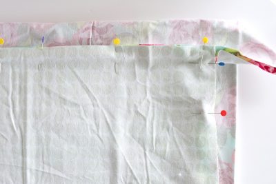 pinned fabric on table top wrong side out