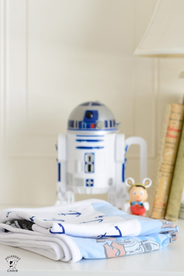 Fabric on whit table with R2-D2 in the background
