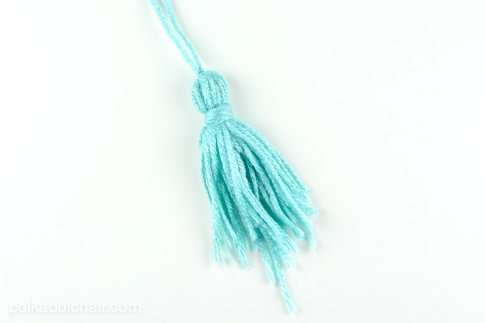 How to make a mini tassel that attaches to a zipper out of yarn -