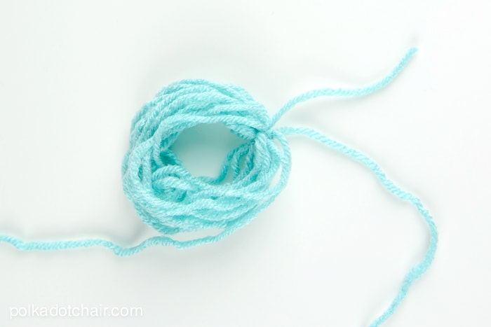 How to make a mini tassel that attaches to a zipper out of yarn -