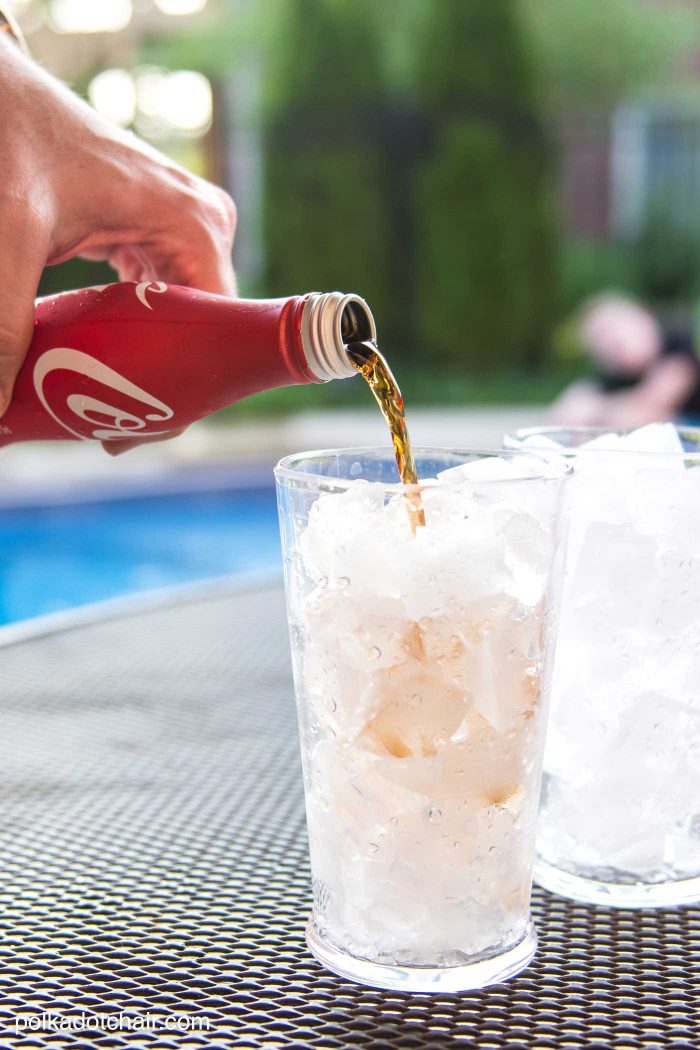 DIY Outdoor Bowling Game, made using Coke bottles, a yoga mat and pool noodles!!