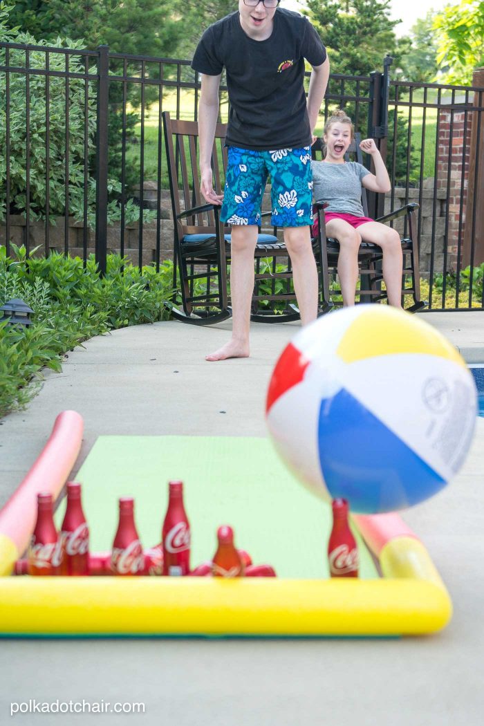 DIY Outdoor Bowling Game, made using Coke bottles, a yoga mat and pool noodles!!