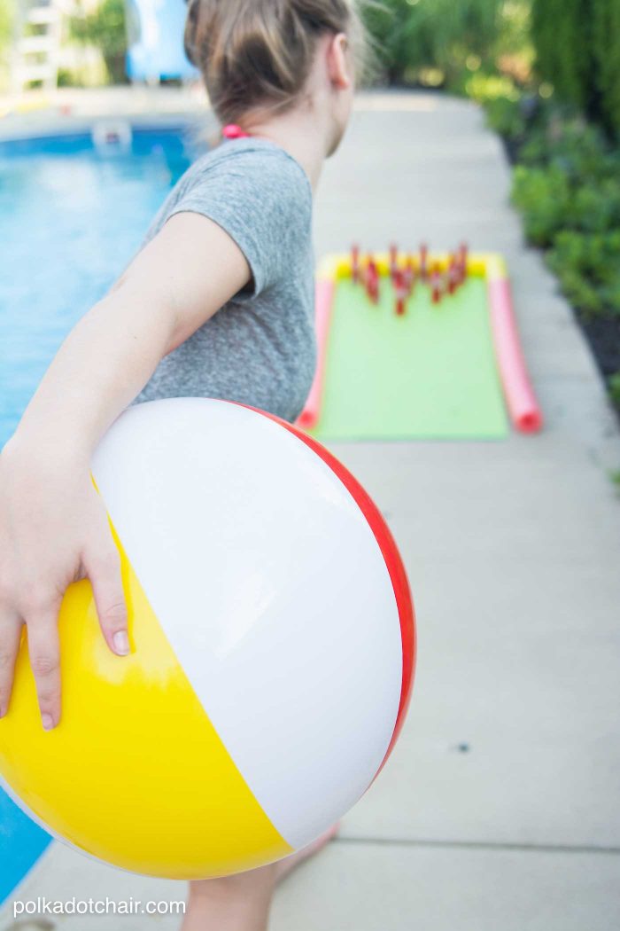 DIY Outdoor Bowling Game, made using Coke bottles, a yoga mat and pool noodles!!