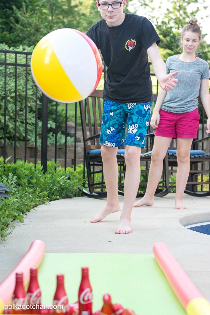 DIY Outdoor Bowling Game, made using Coke bottles, a yoga mat and pool noodles!!