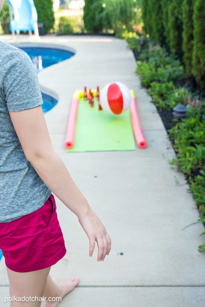 DIY Outdoor Bowling Game, made using Coke bottles, a yoga mat and pool noodles!!