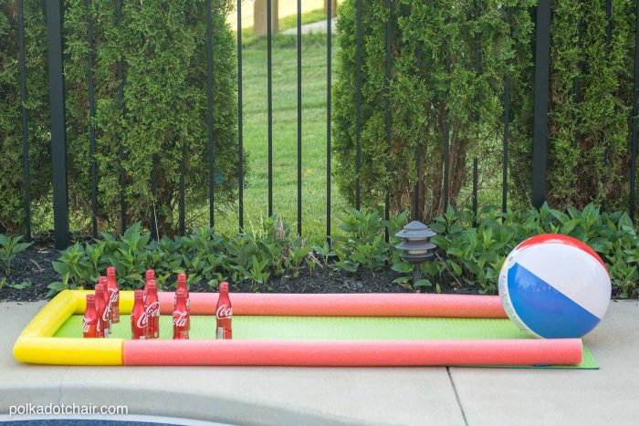 DIY Outdoor Bowling Game, made using Coke bottles, a yoga mat and pool noodles!!