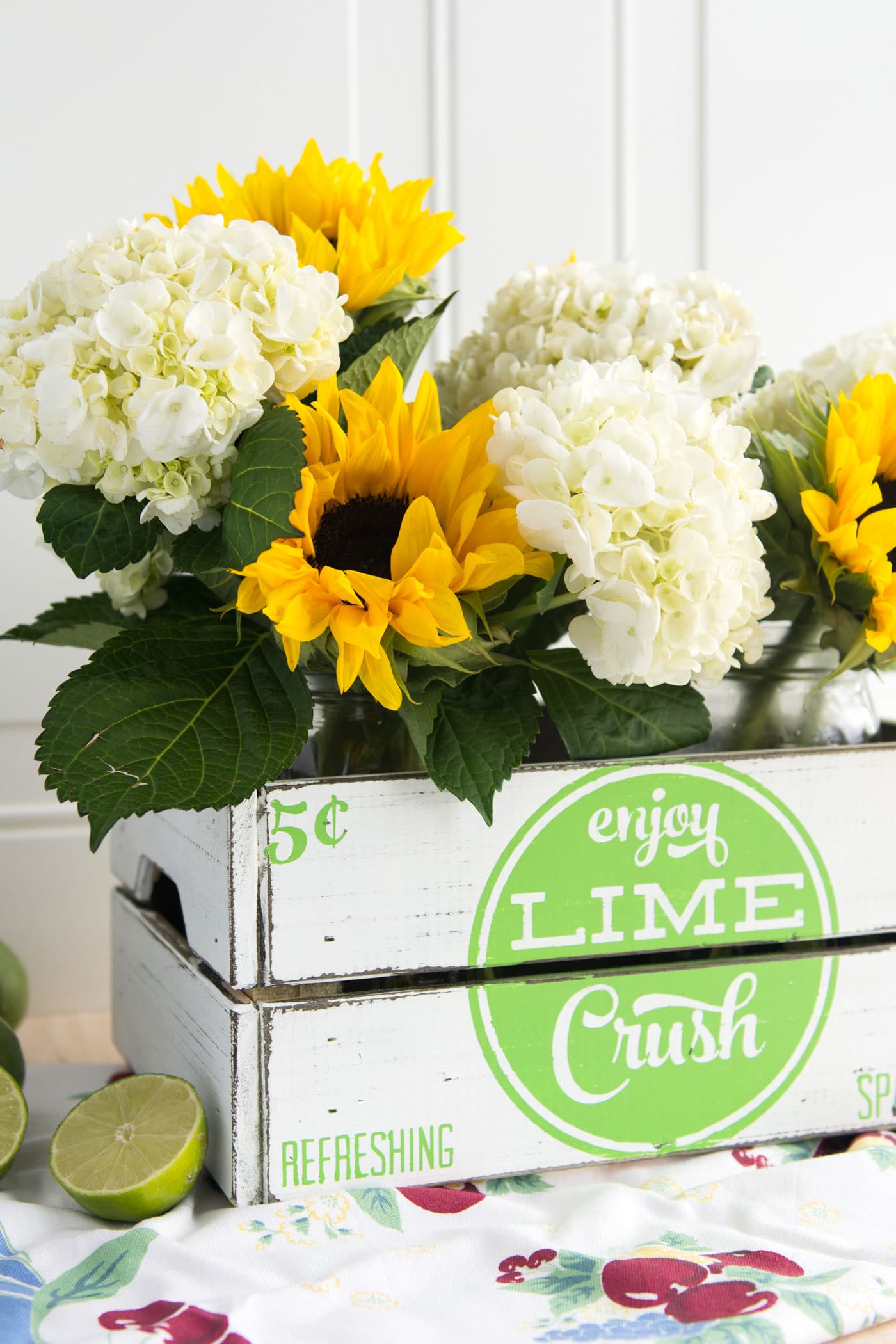 learn how to make your own hand painted vintage soda crate using a stencil. Such a cute project for summer, love the vintage farmhouse style of this crate!