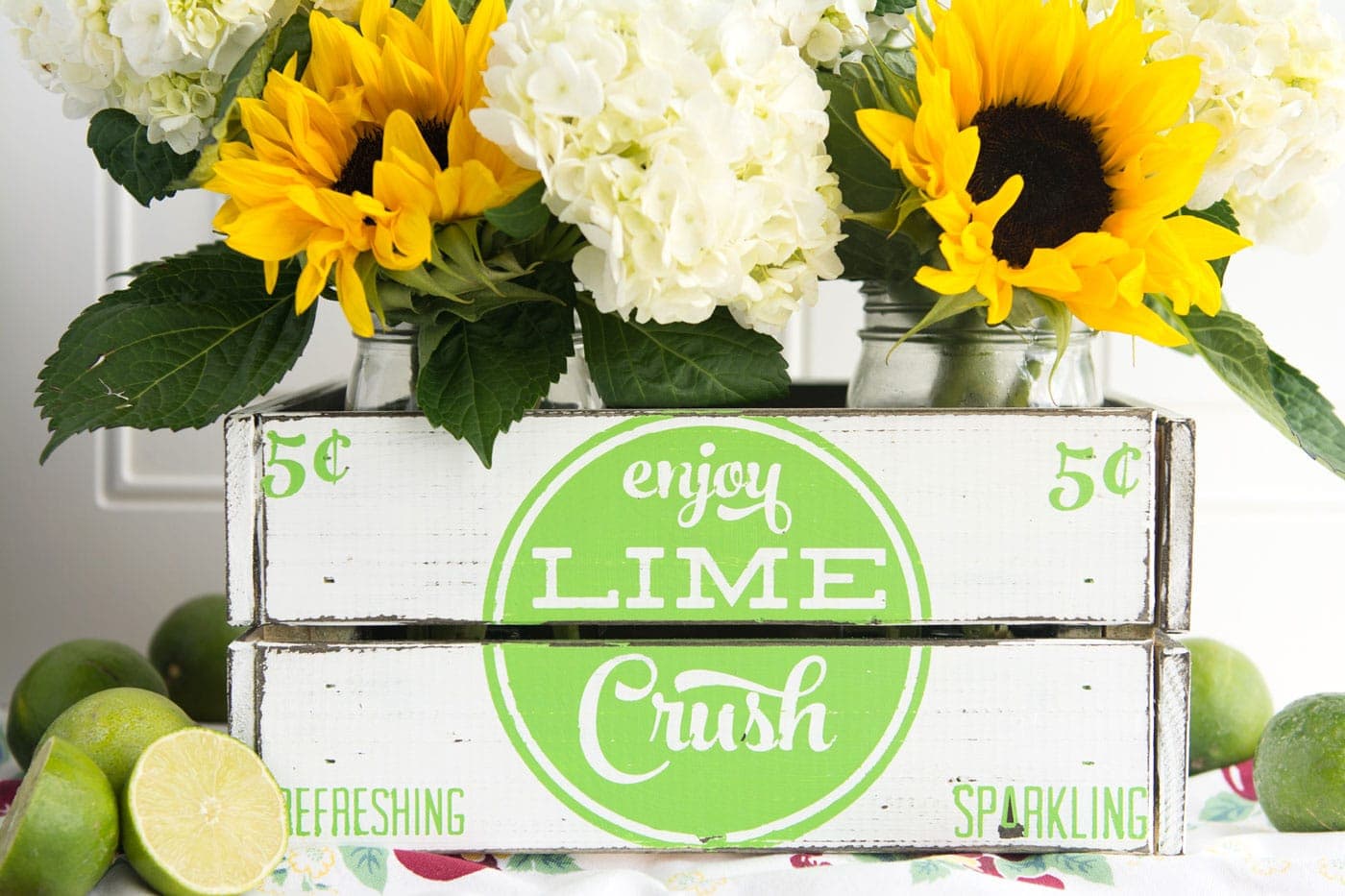 learn how to make your own hand painted vintage soda crate using a stencil. Such a cute project for summer, love the vintage farmhouse style of this crate!