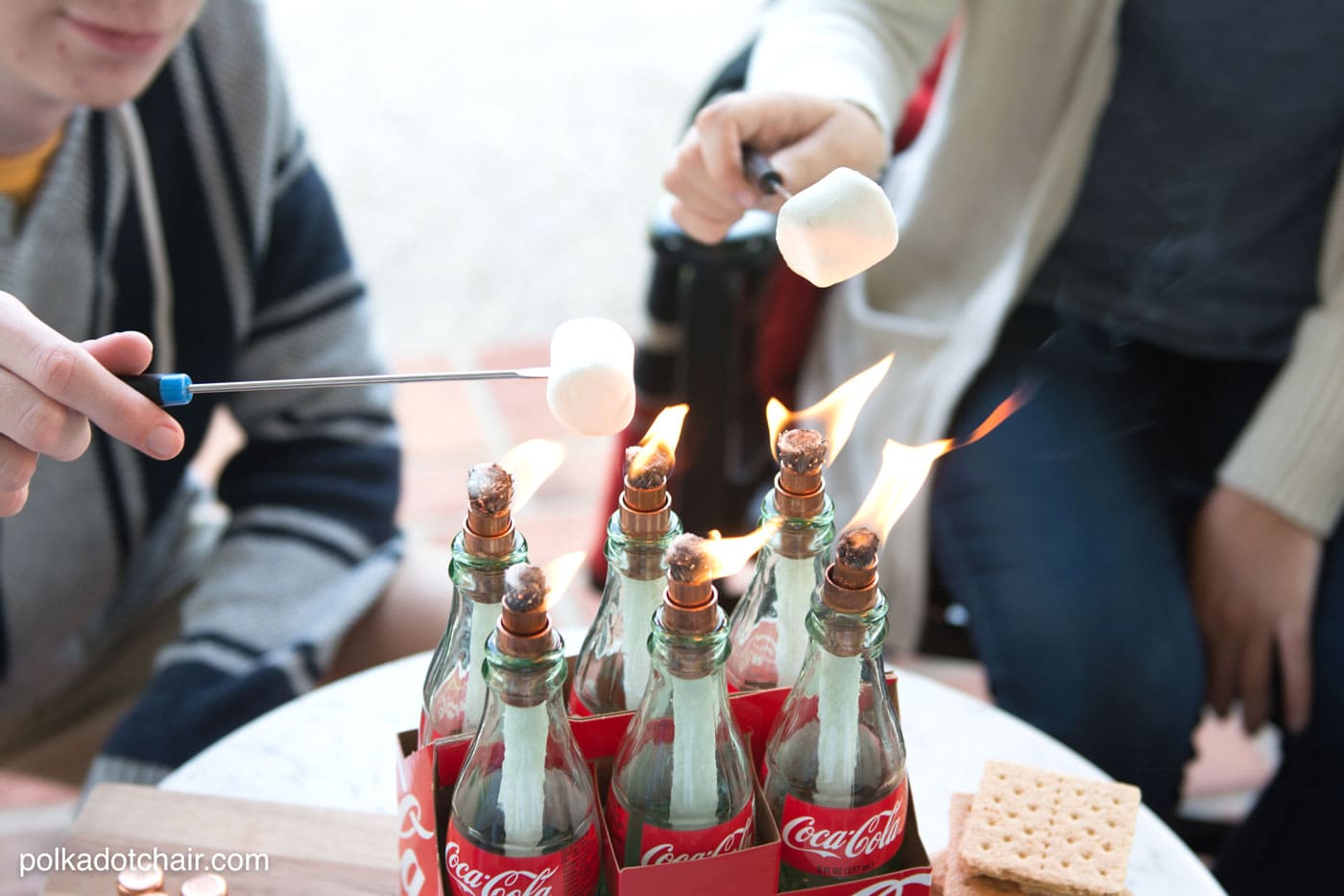 DIY tabletop s'mores maker made from upcycled Coca-Cola bottles