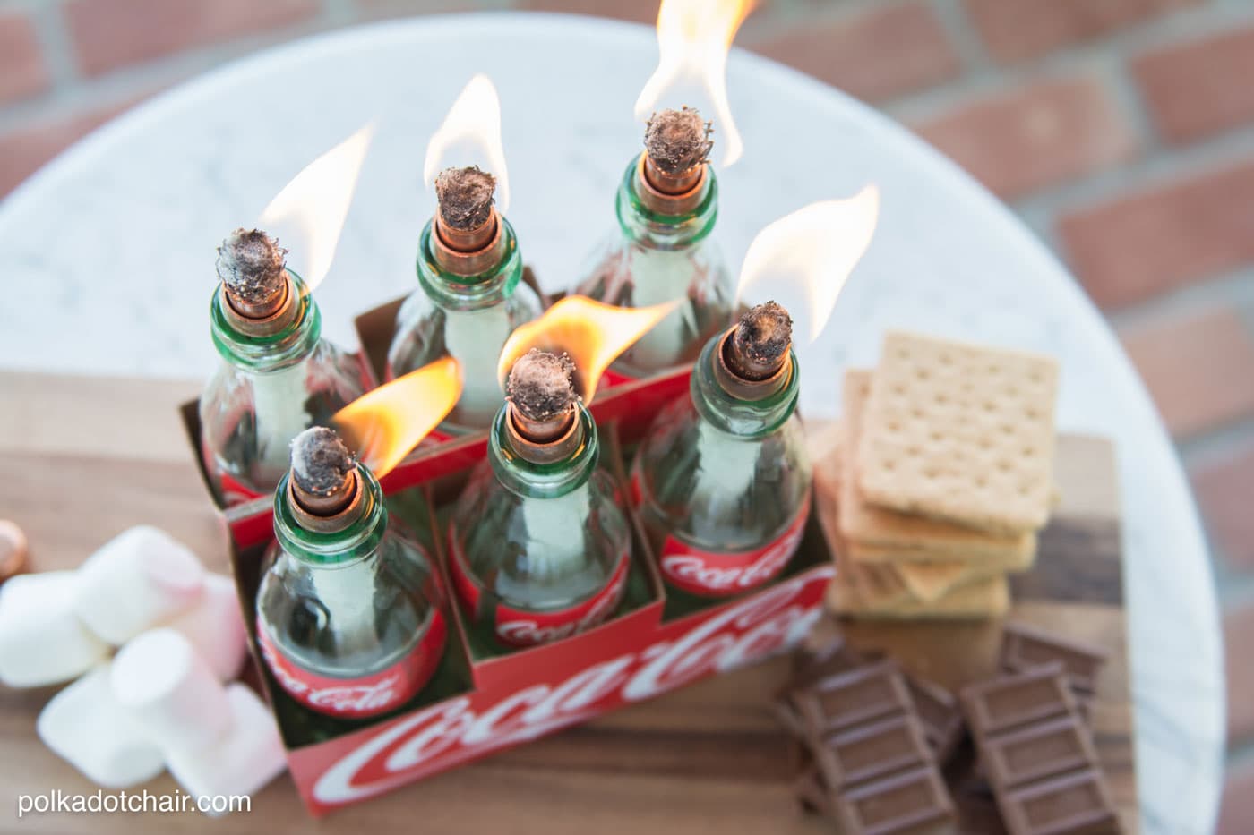 DIY tabletop s'mores maker made from upcycled Coca-Cola bottles