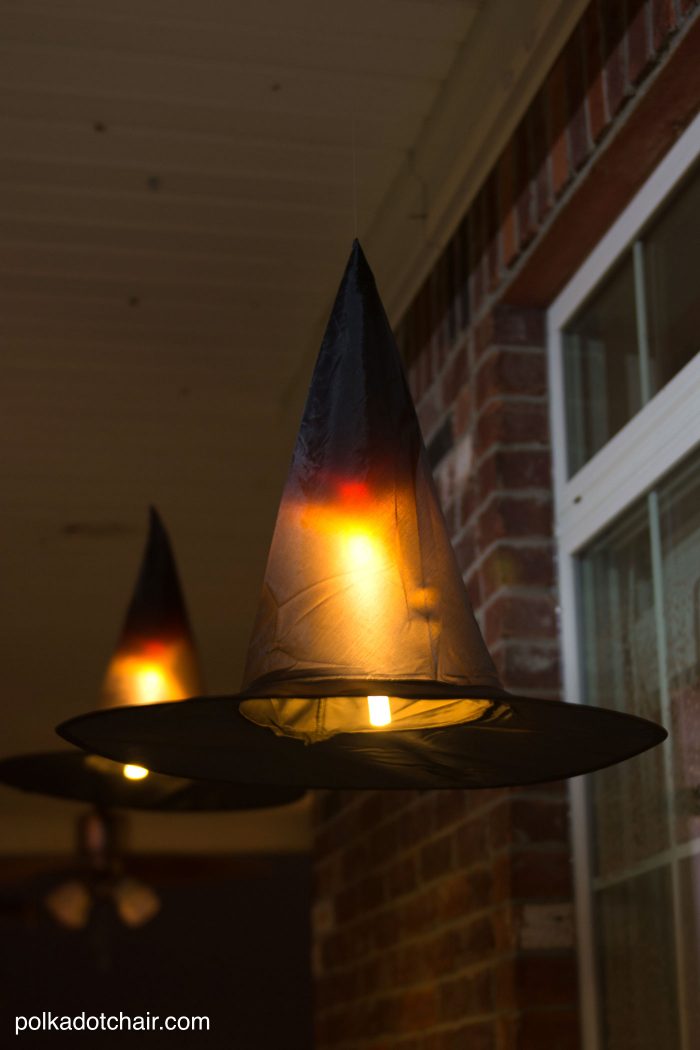 Clever decorating idea for a porch for Halloween, floating Witch's hat luminaries, they even light up at night!