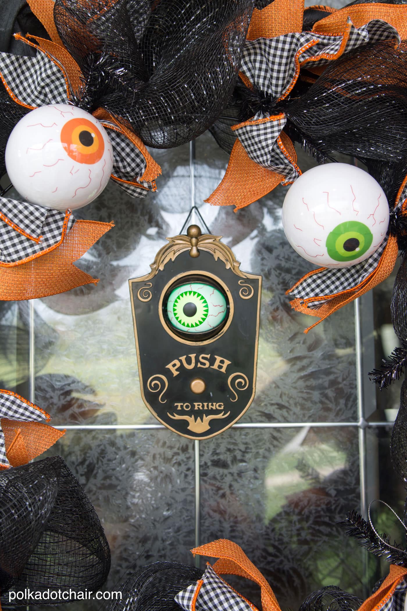 How to make a cute Halloween Eyeball wreath for your front door out of Geo Mesh and ribbon. 