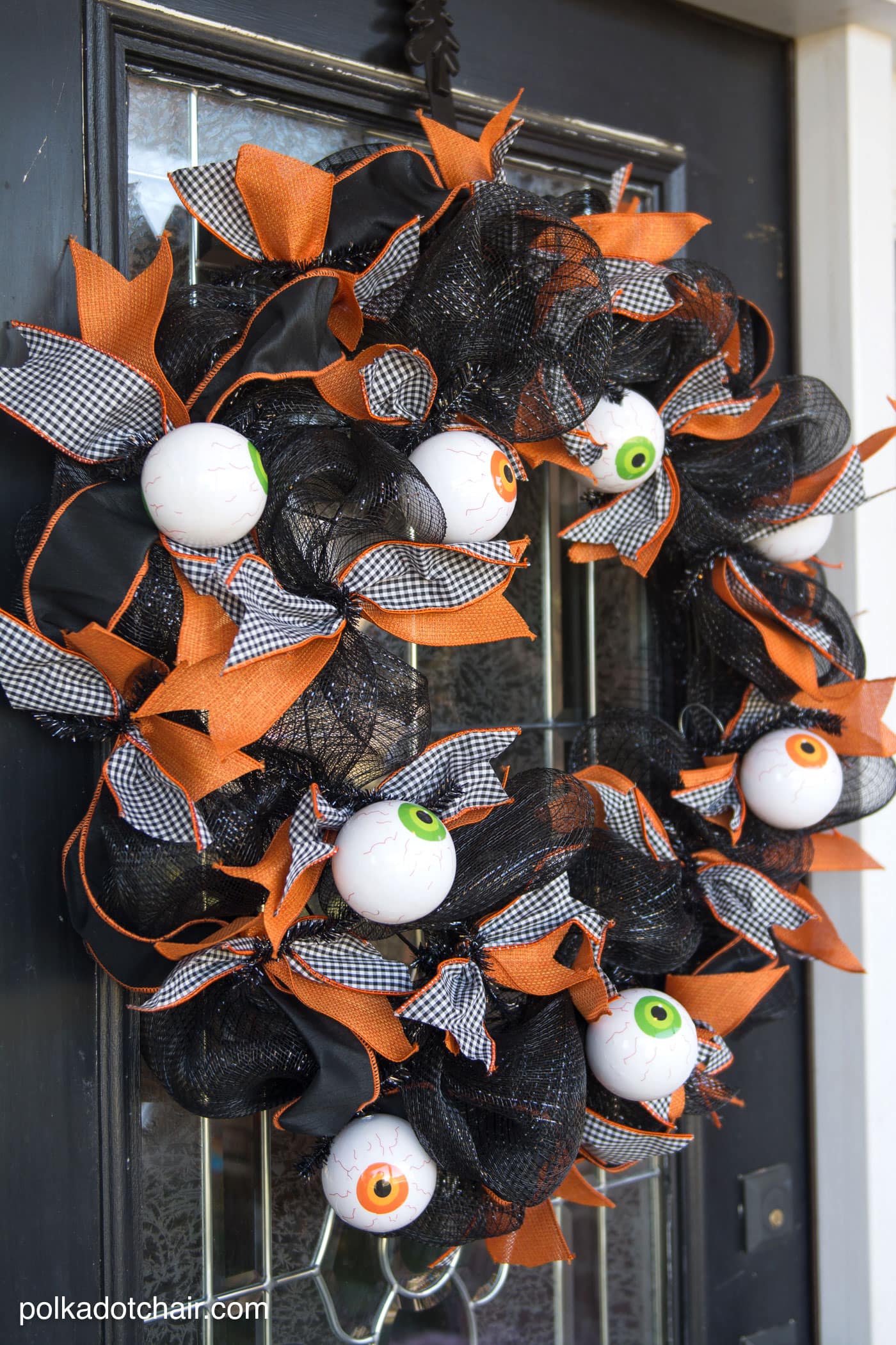 How to make a cute Halloween Eyeball wreath for your front door out of Geo Mesh and ribbon. 