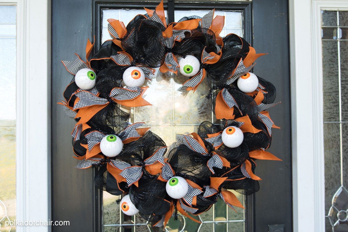 How to make a cute Halloween Eyeball wreath for your front door out of Geo Mesh and ribbon. 