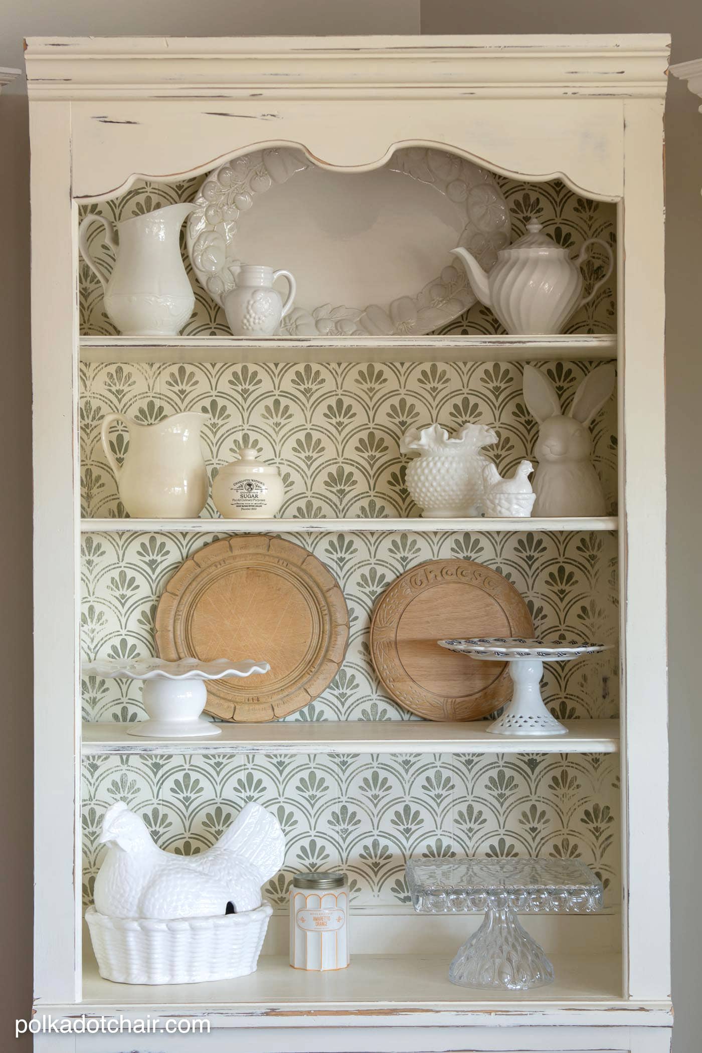 DIY Stenciled Bookcase Project, she painted the bookcase with chalk paint then stenciled a pattern onto the back, looks pretty simple