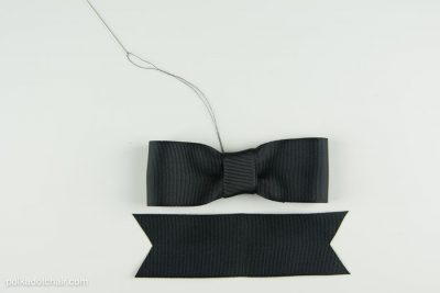 Black bow on white table