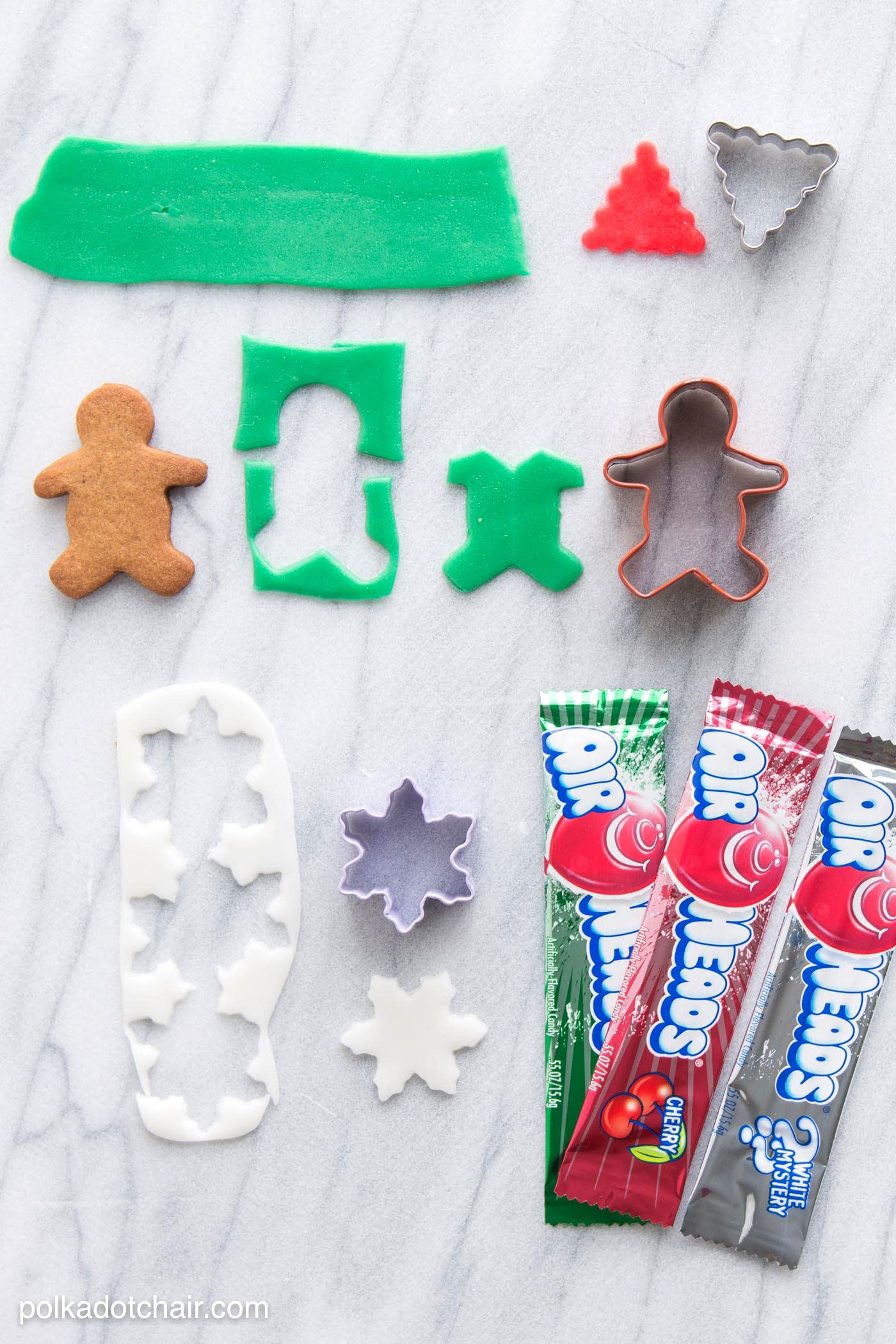 Christmas Gingerbread Cookie Decorating Ideas, use Airheads candy to cut out "clothes" and accessories for your gingerbread men