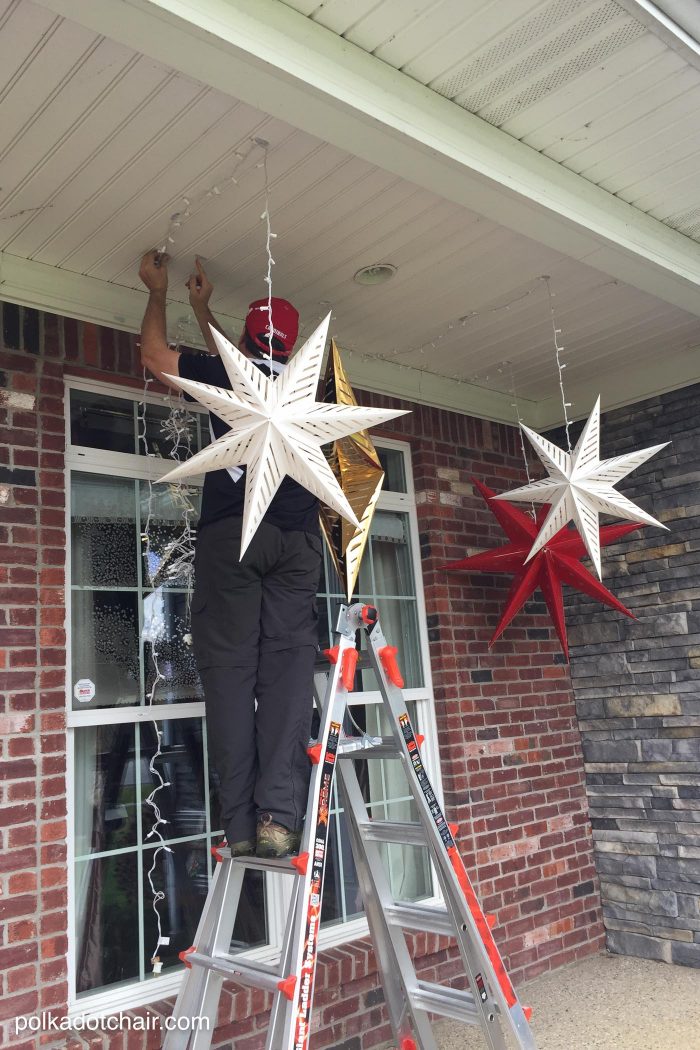 How to hang Star Luminaires on your front porch- what a clever idea for decorating your porch for Christmas