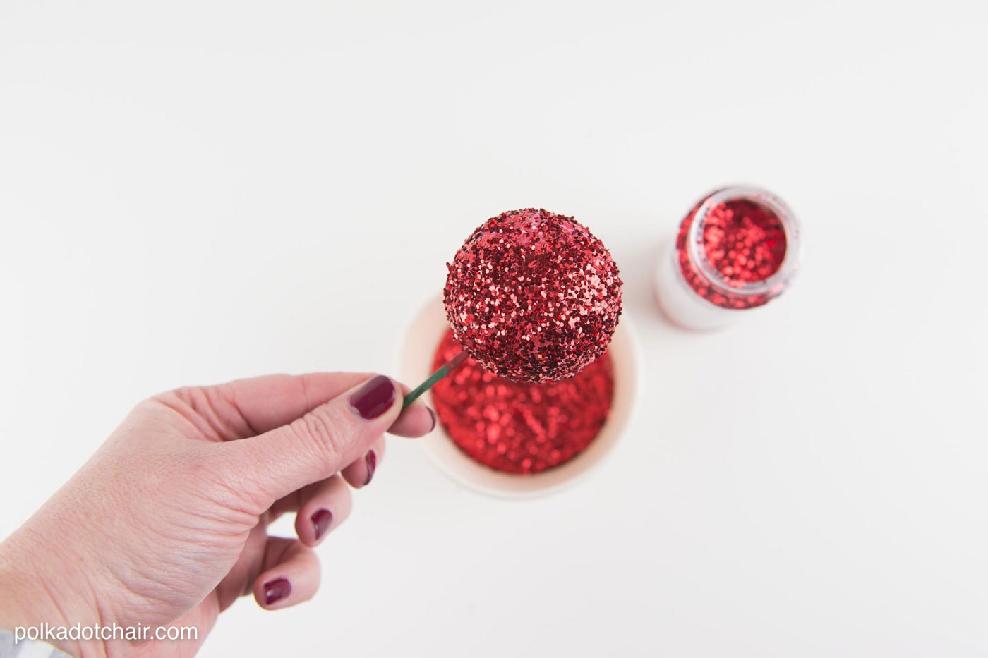 DIY Holly Berry Christmas Wreath made with ribbon, styrofoam balls, felt and glitter