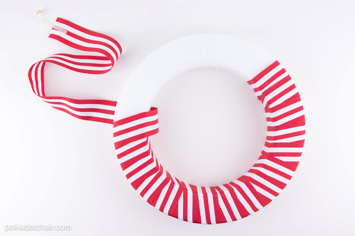 DIY Holly Berry Christmas Wreath made with ribbon, styrofoam balls, felt and glitter