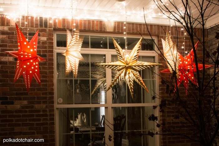 How to hang Star Luminaires on your front porch- what a clever idea for decorating your porch for Christmas