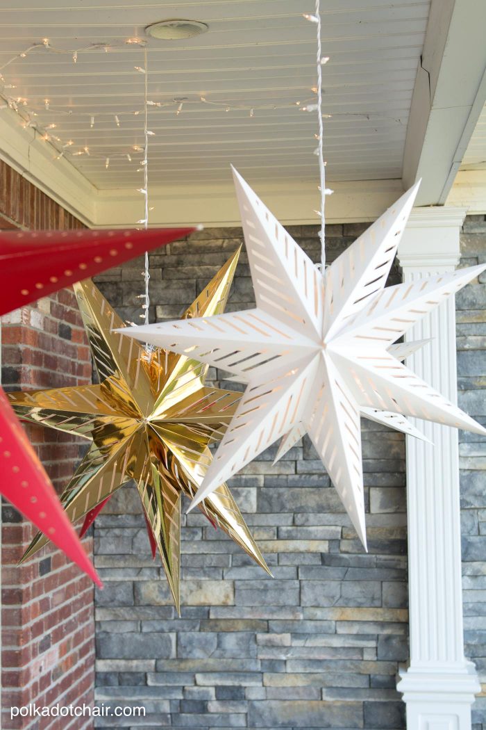 How to hang Star Luminaires on your front porch- what a clever idea for decorating your porch for Christmas