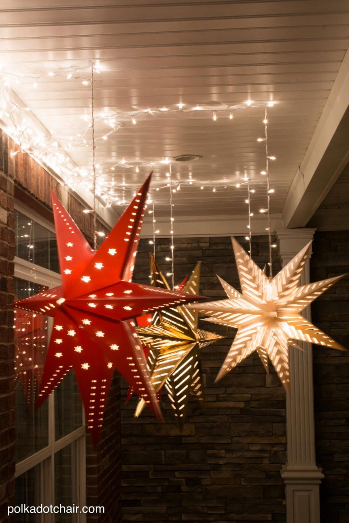 How to hang Star Luminaires on your front porch- what a clever idea for decorating your porch for Christmas