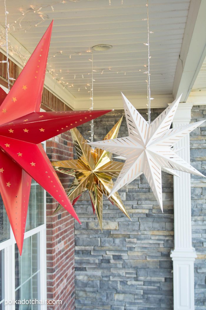 How to hang Star Luminaires on your front porch- what a clever idea for decorating your porch for Christmas