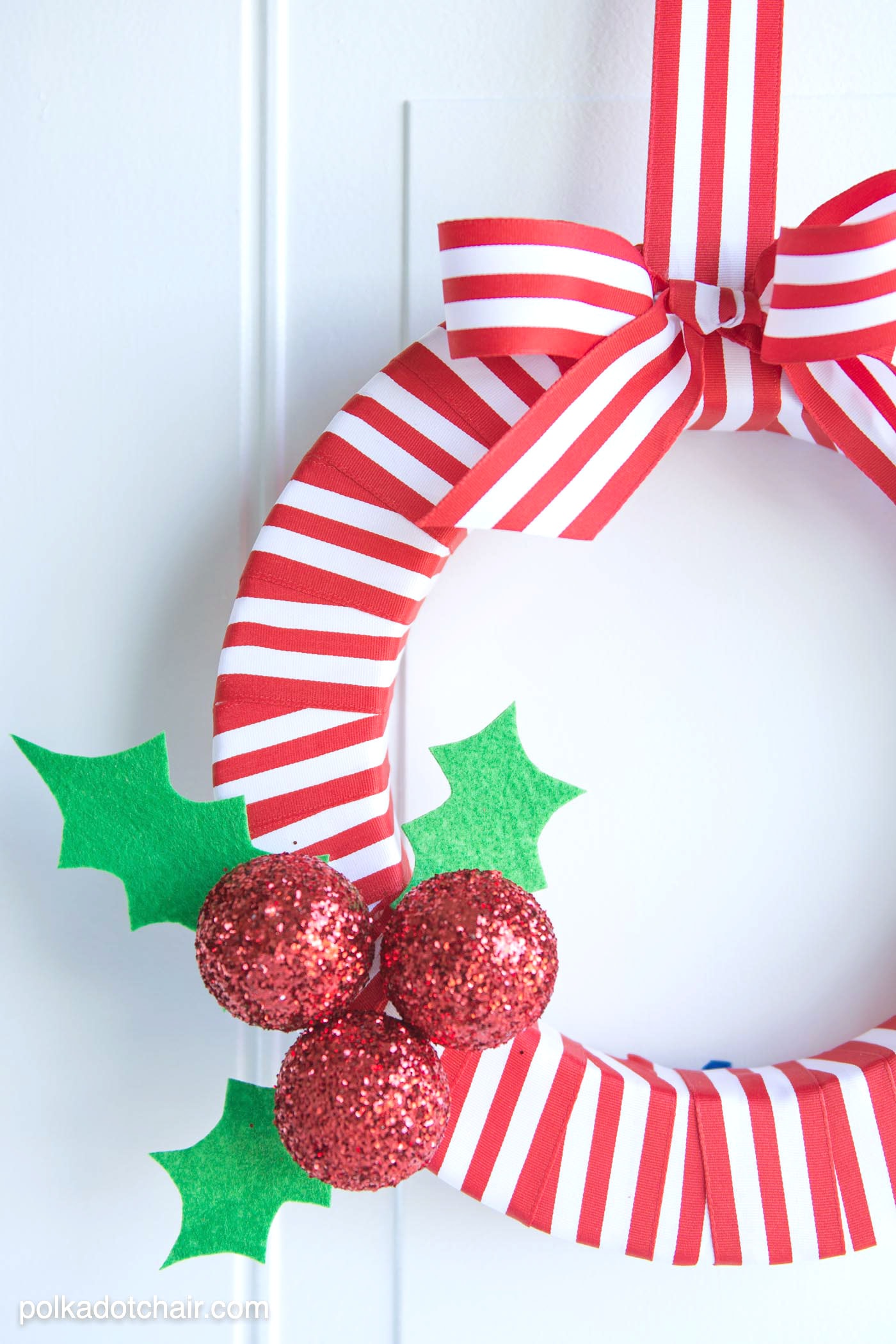 DIY Holly Berry Christmas Wreath made with ribbon, styrofoam balls, felt and glitter