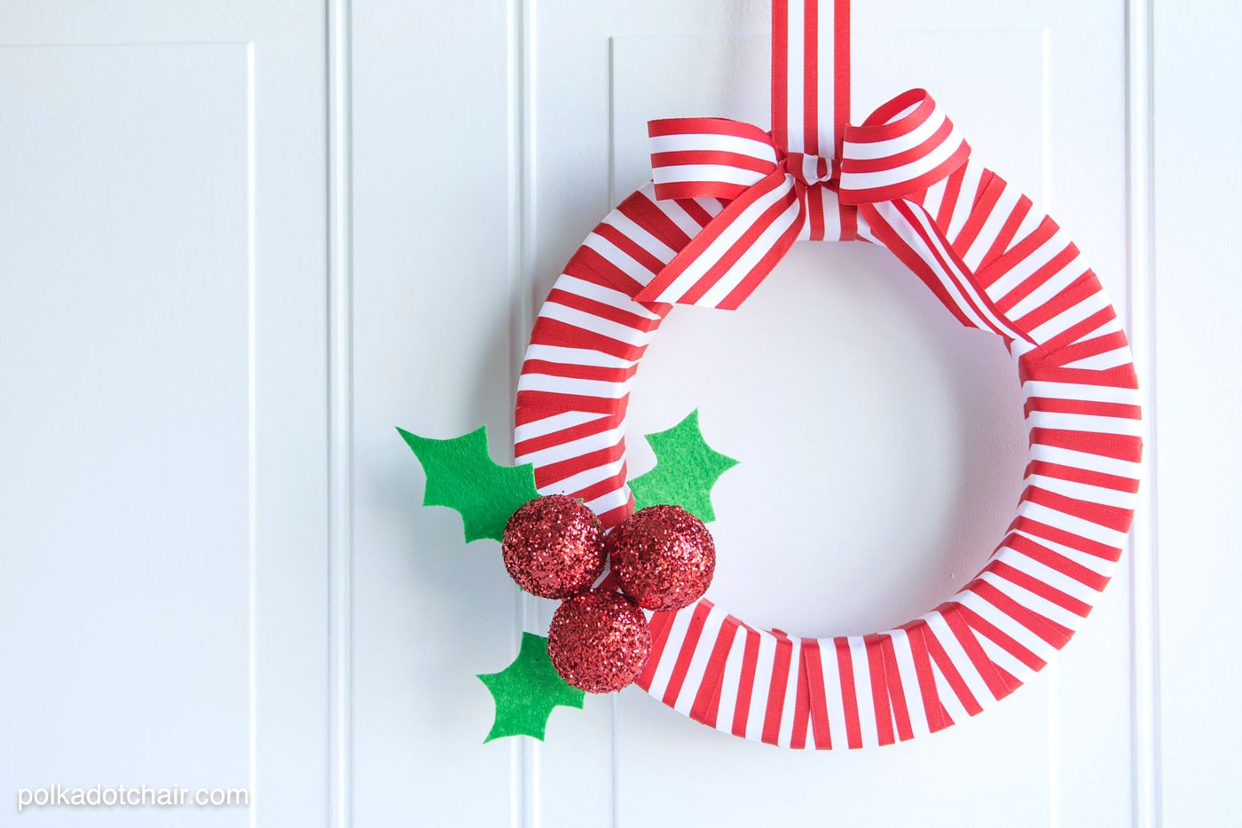 DIY Holly Berry Christmas Wreath made with ribbon, styrofoam balls, felt and glitter