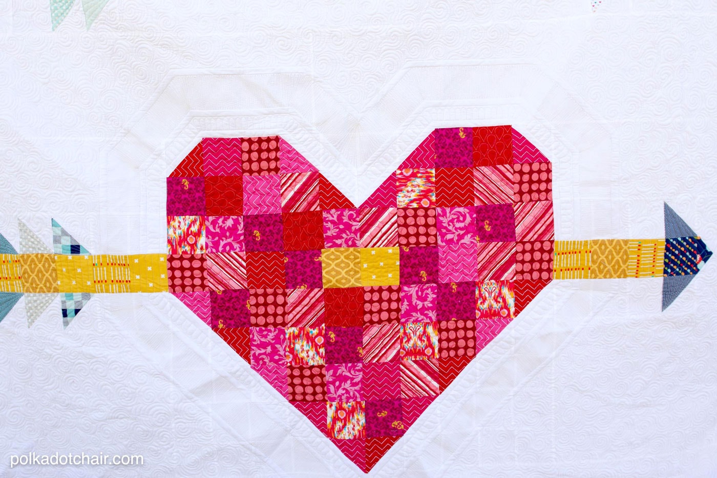 Cupid's Arrow Quilt Pattern, a patchwork heart and arrow quilt pattern - great for Valentine's Day sewing 