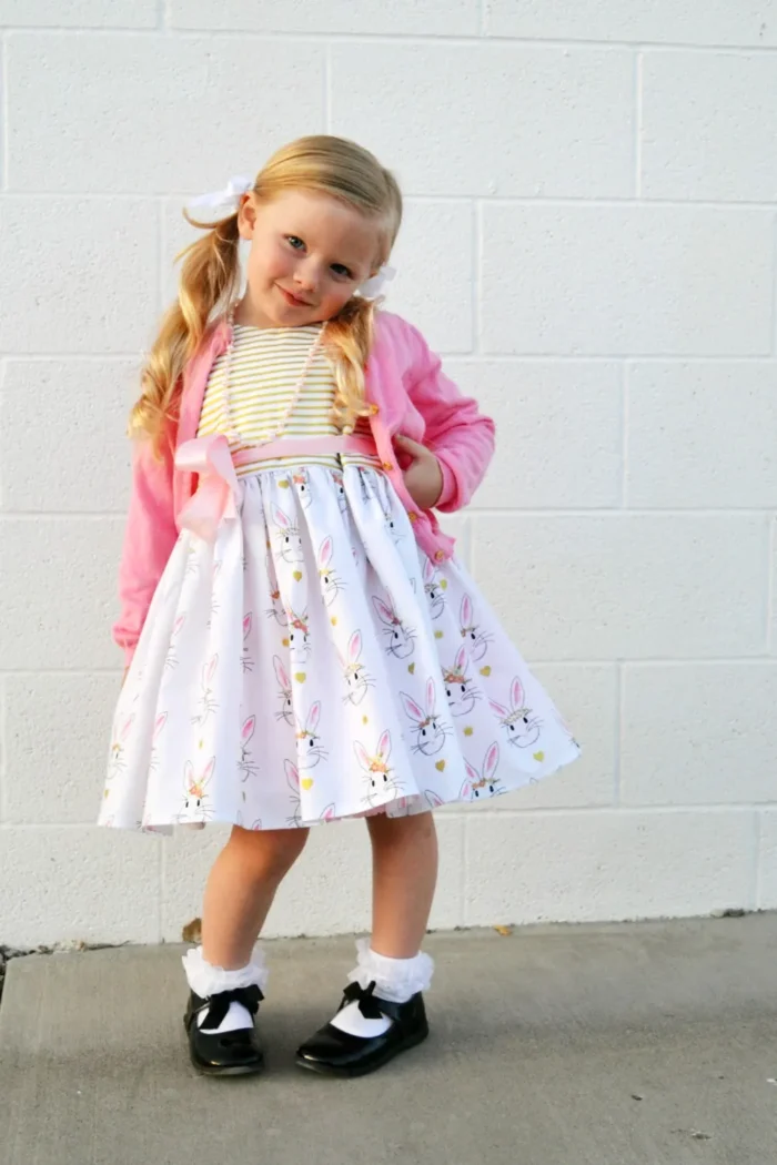 girl wearing pink and white easter dress